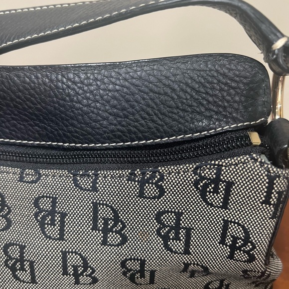 Dooney & Burke black logo printed fabric with black pebbled leather accents. - Picture 4 of 9